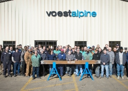 voestalpine Nortrak Decatur employees with 10,000th manganese casting. Photo provided by Valerie Cook