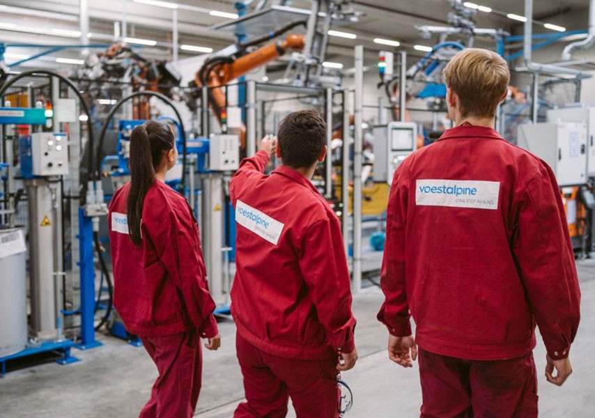 voestalpine employees in a production hall