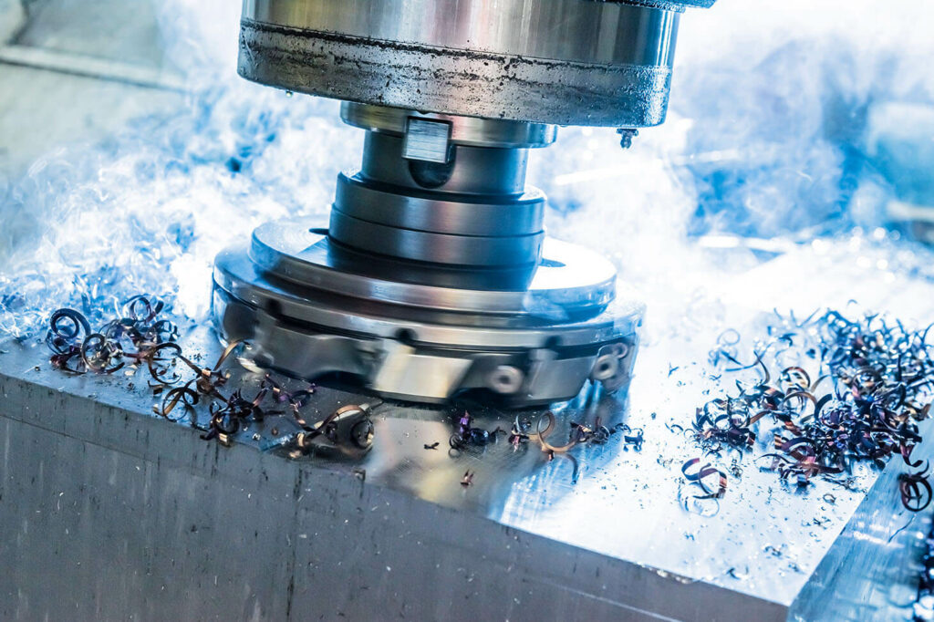 Close-up of milling head during milling in a steel block