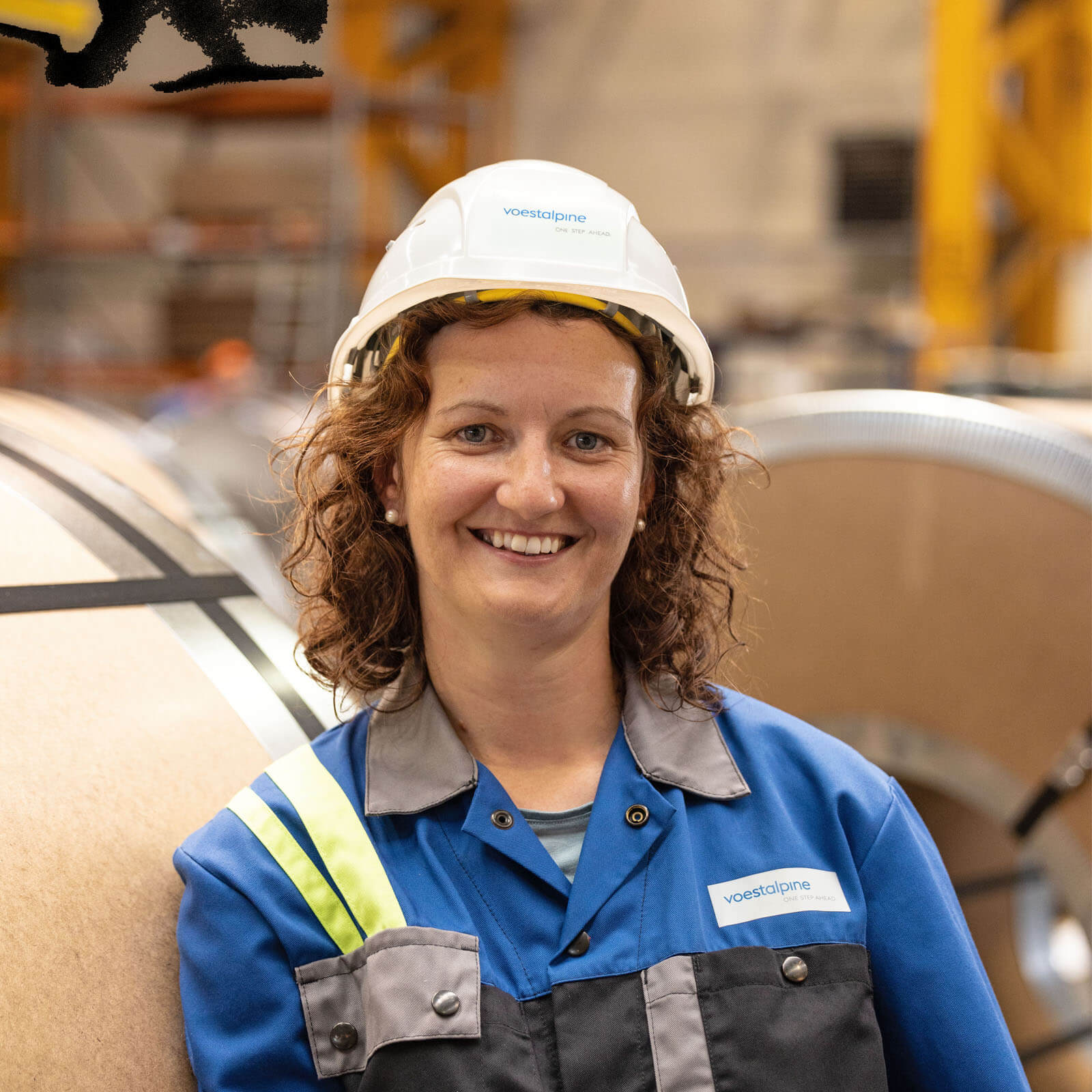 Voestalpine employee Michaela took part in the image film and smiles for the camera at her workplace