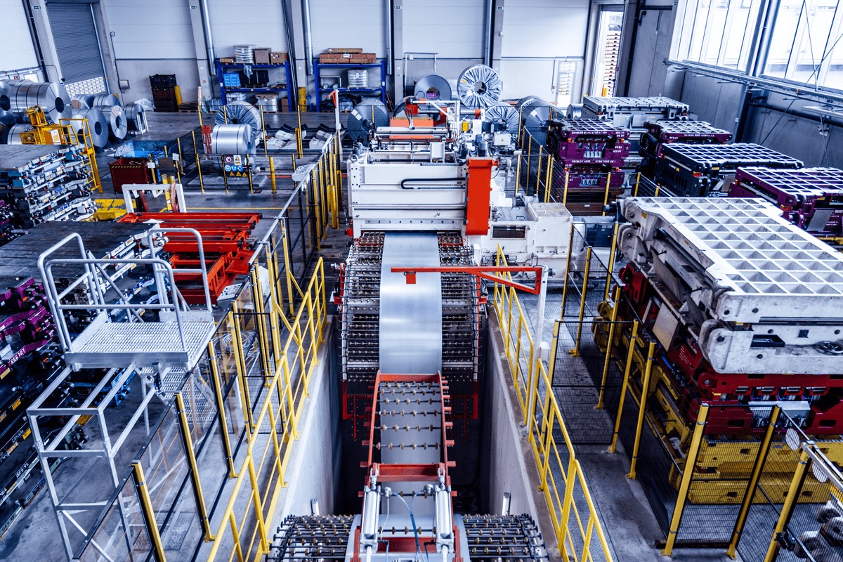 Shot from above in a voestalpine factory hall with machines for rolling and coiling steel