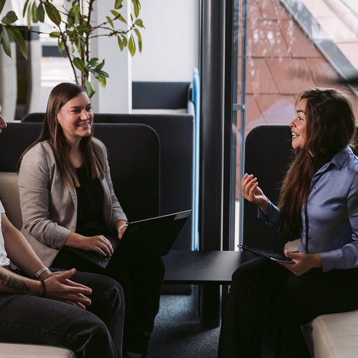 Gabriela in a meeting with a colleague and an employee