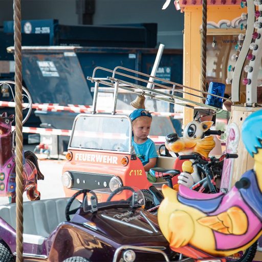 Children's carousel rides at the summer festival in Dettingen