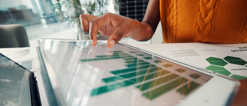 Document, data and hands with tablet screen in office, above and risk management for sustainability. ESG consultant, paperwork and person with tech for environmental benefits and renewable energy