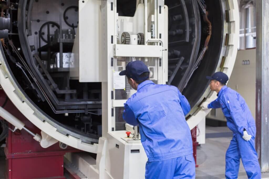 voestalpine heat treatment experts loading a 15 tonne furnace.
