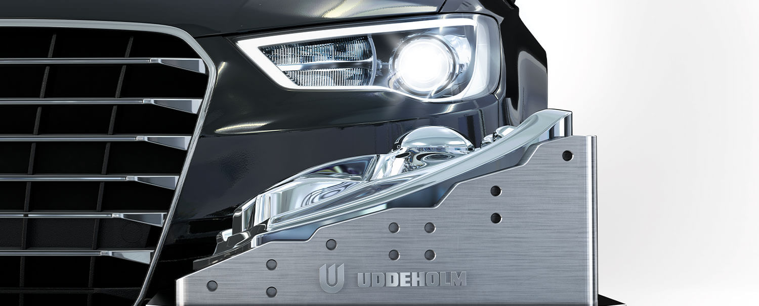 Uddeholm headlight plastic mold in front of car
