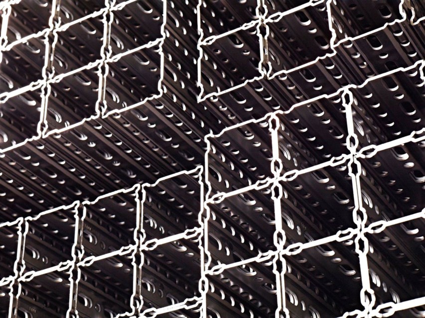 bundle of perforated tube sections in steel